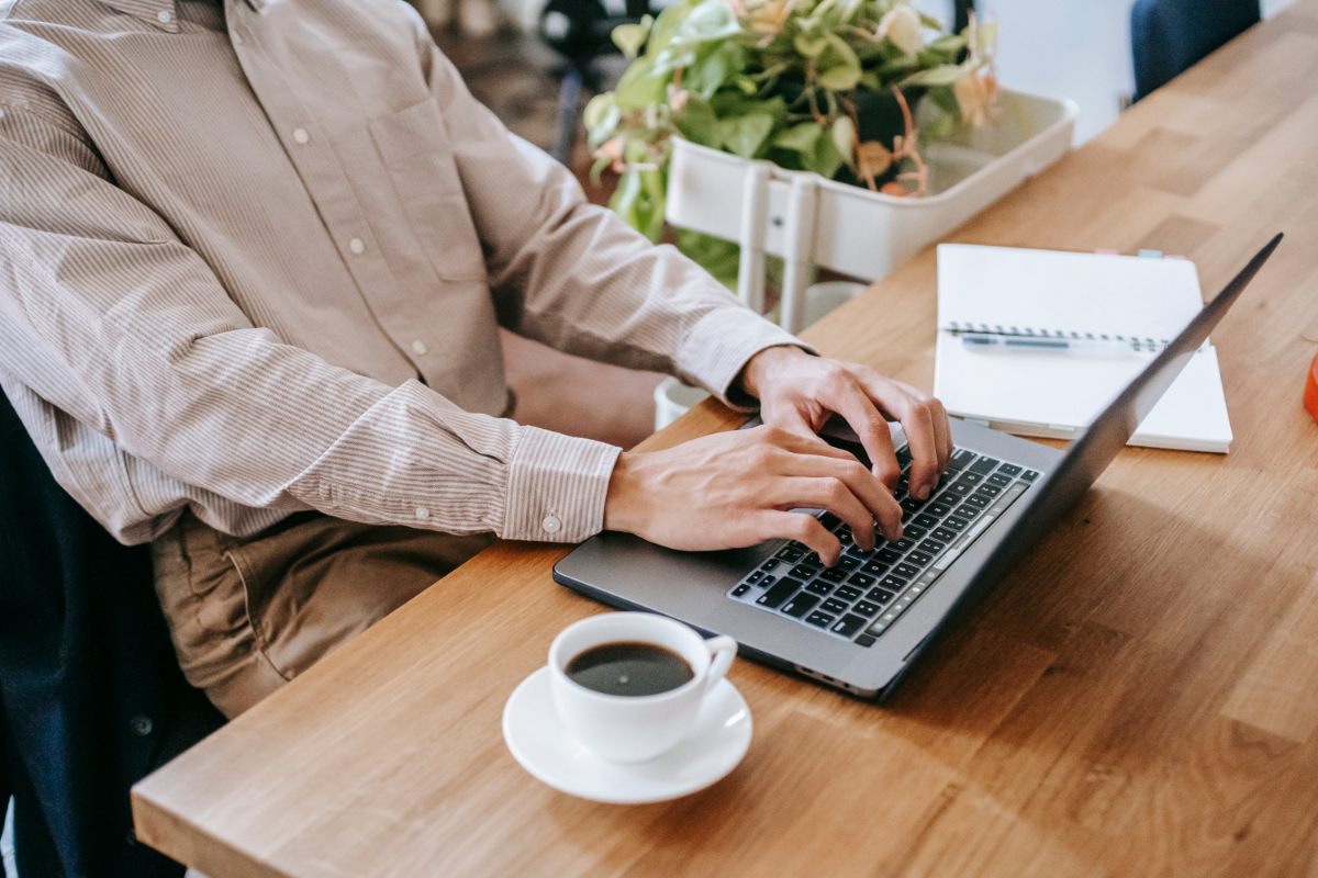 man working remotely on laptop