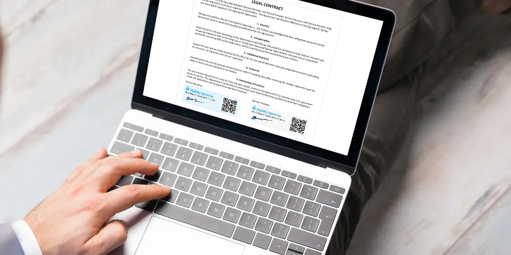 A man uses an electronic signature to sign a contract